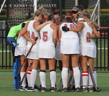  “Alone we can do so little; together we can do     so much.” -Helen Keller -                                        Varsity Girls Field Hockey Team demonstrate teamwork and community before they take the field.   Photo Credit:  Dan Burke