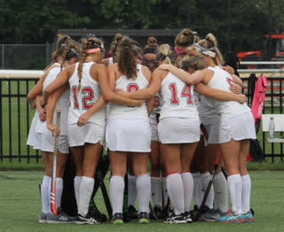 The team having a moment together before they head on to the field to face competition.  Photo Credit: Mr. Daniel Burke