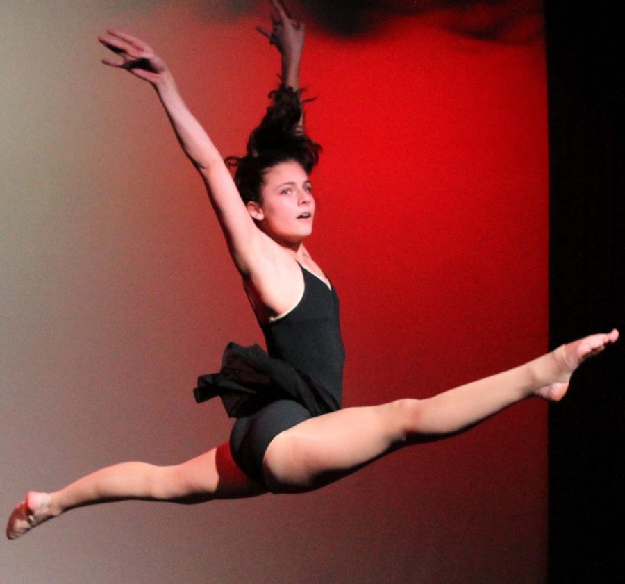 “Sierra Guluzian ‘20 leaps across the stage performing another emotionally connecting piece. Photo Credit: Mr. Daniel Burke